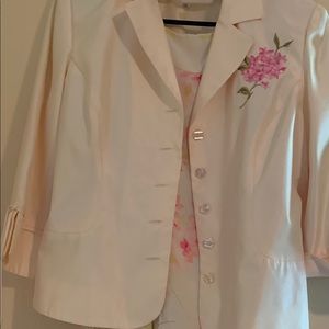 Jacket with skirt matching outfit.